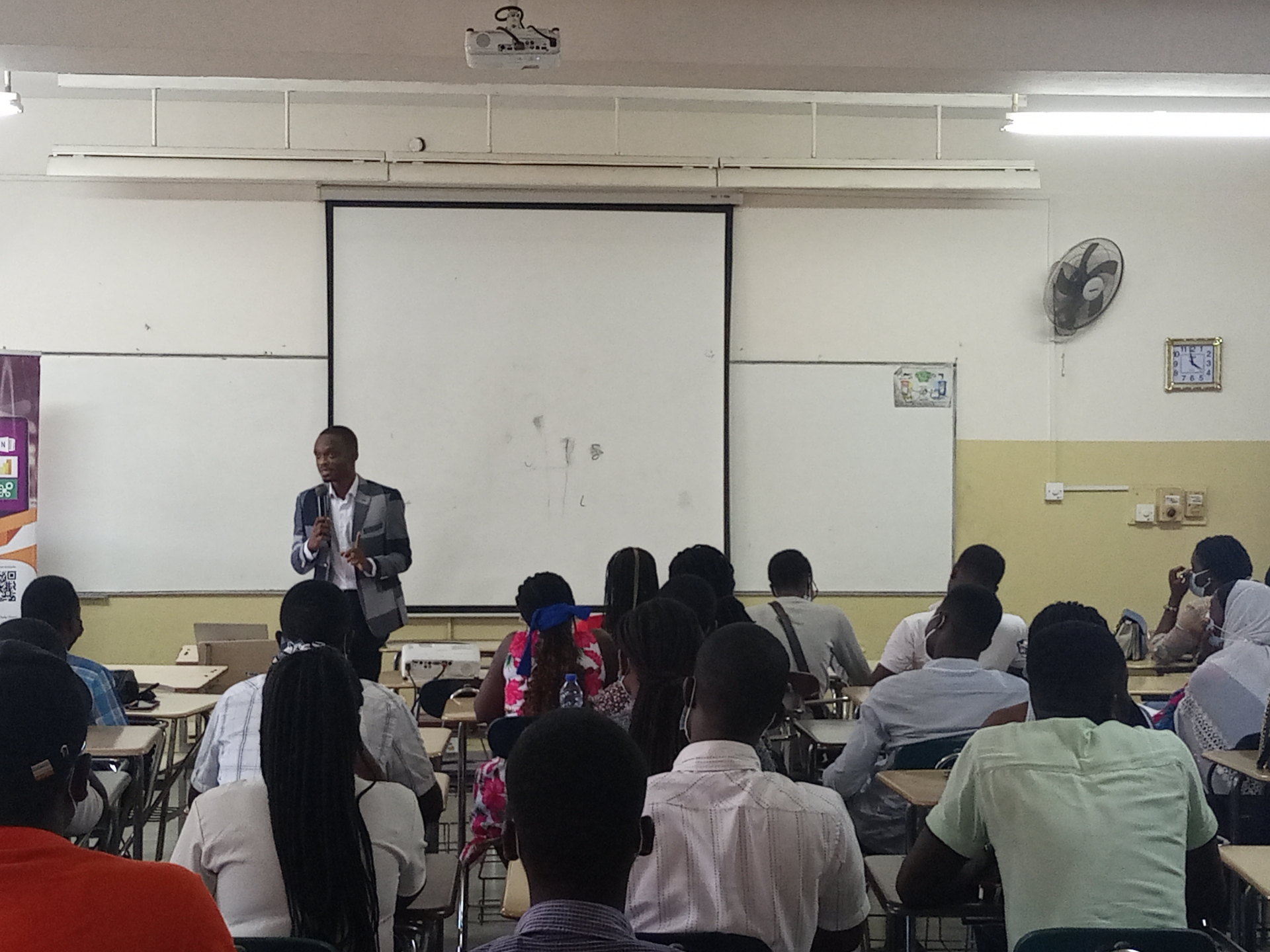 Wide view of a Finex Initiative classroom with facilitator and seated participants
